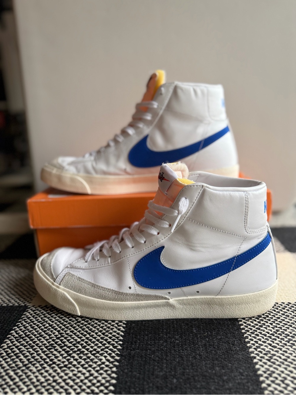 Nike White High-Top Sneakers with Blue Swoosh
